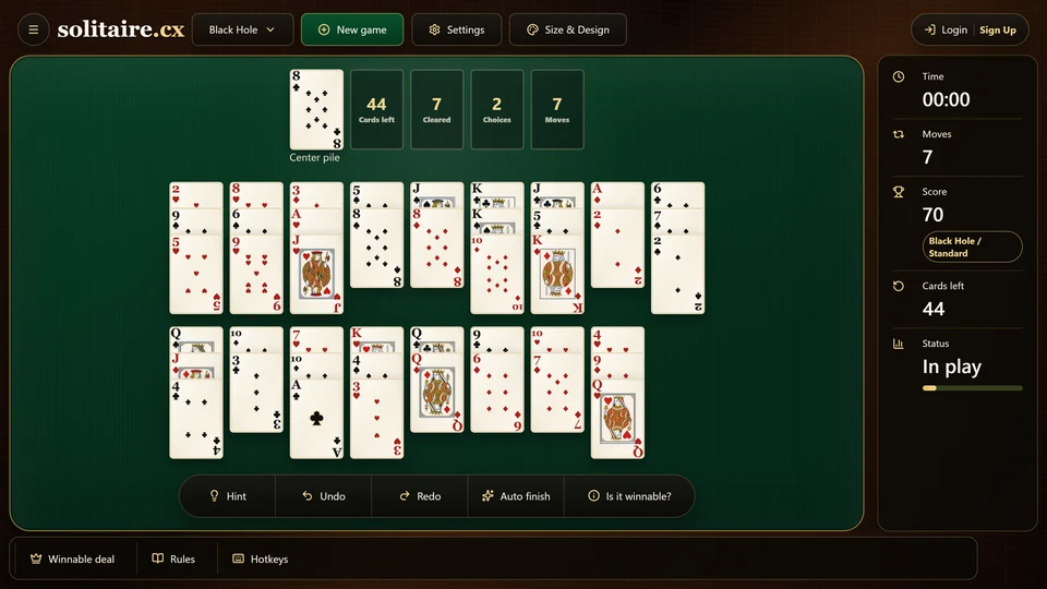Black Hole Solitaire early in a certified deal with cards removed from several fans and a new rank on the center pile.