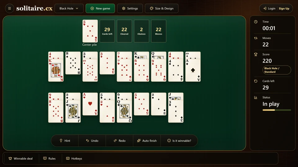 Black Hole Solitaire midgame with a mixture of full, shortened and empty fans around the center pile.