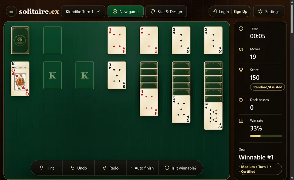 A Klondike game a few moves in, with an Ace and a two moved up to the foundations, a King and Queen sequence in one column and 2 empty columns.