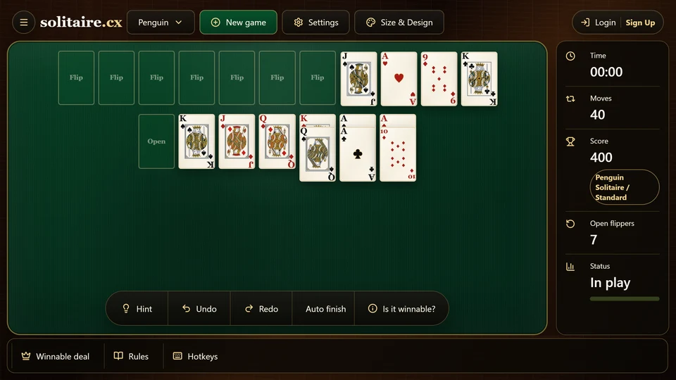 A late Penguin Solitaire position with most cards on foundations and the remaining suited packets exposed.
