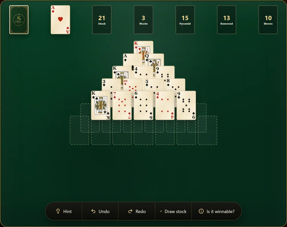 A Pyramid Solitaire game partway through, with several cards lifted out of the lower rows leaving gaps in the triangle and a few cards turned onto the waste.