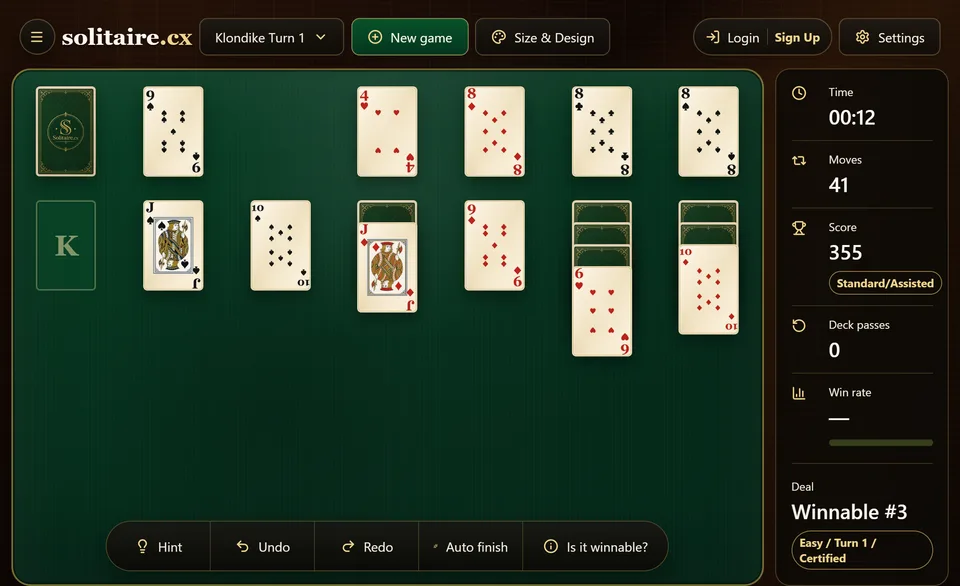 A Klondike game with a King moved into an emptied column, a Queen and Jack paired nearby and the foundations well up each suit.