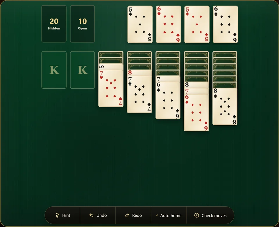 A Yukon Solitaire game in progress, with the foundations climbing in every suit, 2 columns emptied to King only slots and face down cards still waiting in the others.